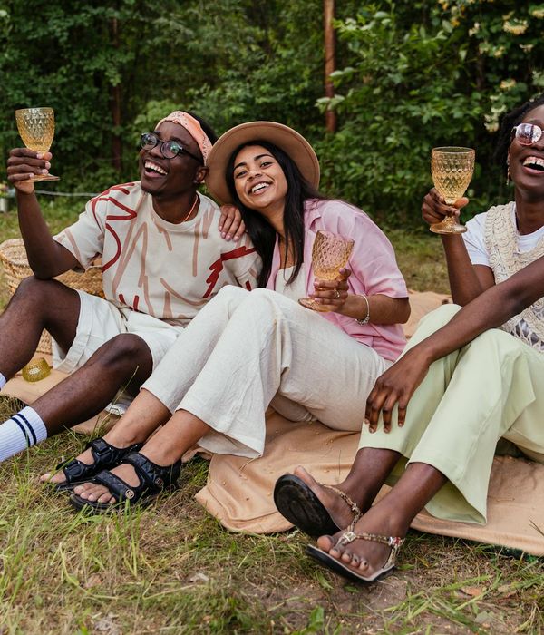 Diverse group of people smiling and looking relaxed.